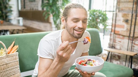 Patient in Tampa eating with dental implants