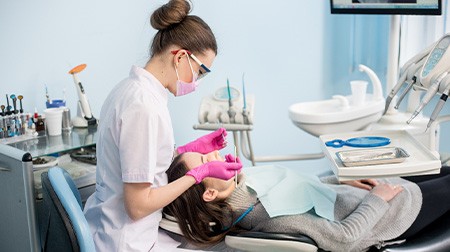 Woman having her teeth cleaned