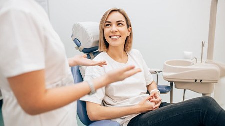 Woman smiles at dentist