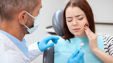 An unhappy woman waiting to have her toothache treated