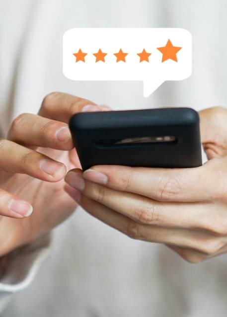 Person leaving a five star review on their phone
